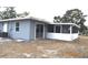 Rear view of house showcasing screened porch at 4645 Commodore Ave, Spring Hill, FL 34606