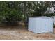 Grey metal storage shed in backyard at 4645 Commodore Ave, Spring Hill, FL 34606