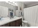 Bathroom features a vanity with a quartz countertop, a shower/tub combo, and a toilet at 4802 51St W St # 224, Bradenton, FL 34210