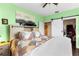 Main bedroom with barn door, ceiling fan and large window at 4802 51St W St # 224, Bradenton, FL 34210