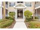 Condo building entrance with stairs and landscaping at 4802 51St W St # 224, Bradenton, FL 34210