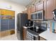 Kitchen with stainless steel appliances and wood cabinets at 4802 51St W St # 224, Bradenton, FL 34210