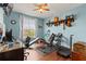 Home office or gym with window, wood flooring, and home exercise equipment at 4802 51St W St # 224, Bradenton, FL 34210