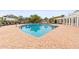 Community pool with plenty of lounge chairs at 4802 51St W St # 224, Bradenton, FL 34210