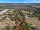 Aerial view showing home on large lot with mature trees at 5104 Nesmith Rd, Plant City, FL 33567