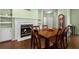 Dining room with fireplace and grandfather clock at 5104 Nesmith Rd, Plant City, FL 33567