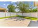 Spacious backyard with concrete patio and a tree at 5200 Suncatcher Dr, Wesley Chapel, FL 33545