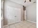 Bedroom with double door closet and tile flooring at 5200 Suncatcher Dr, Wesley Chapel, FL 33545