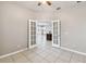 Bright office space with French doors leading to the kitchen at 5200 Suncatcher Dr, Wesley Chapel, FL 33545