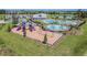 Playground and pool with a clubhouse at 5200 Suncatcher Dr, Wesley Chapel, FL 33545