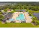 Resort-style pool with lounge chairs and a clubhouse at 5200 Suncatcher Dr, Wesley Chapel, FL 33545