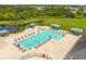 Relaxing community pool with plenty of lounge chairs at 5200 Suncatcher Dr, Wesley Chapel, FL 33545