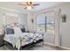 This bedroom boasts a ceiling fan and a window bringing in tons of natural light at 5864 Mckee Lake N Dr, St Petersburg, FL 33709