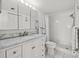 Clean bathroom with marble vanity and shower/tub combo at 6020 Shore S Blvd # 101, Gulfport, FL 33707