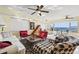 Spacious living room with bay views and eclectic furnishings at 6020 Shore S Blvd # 101, Gulfport, FL 33707