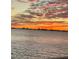 Stunning sunset over calm water with city skyline in the distance at 6020 Shore S Blvd # 101, Gulfport, FL 33707