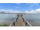 Wooden dock extending into the water at 6343 Palma Del Mar S Blvd # 225, St Petersburg, FL 33715