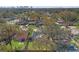 Expansive aerial view of the neighborhood, showcasing the lush greenery, mature trees, and proximity to the city skyline at 705 W Kentucky Ave, Tampa, FL 33603