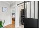 Laundry area with stacked washer and dryer, accessed through a sliding barn door at 705 W Kentucky Ave, Tampa, FL 33603