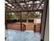 Fenced backyard with pergola and wooden deck at 8014 N Alaska St, Tampa, FL 33604