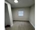 Cozy bedroom with wood-look floors and a closet at 8014 N Alaska St, Tampa, FL 33604