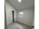 Bright bedroom with wood-look floors and a closet at 8014 N Alaska St, Tampa, FL 33604