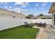 Fenced backyard with patio, artificial turf and loungers at 834 11Th N St, St Petersburg, FL 33705