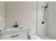 Bathroom with white vanity, quartz countertop and tile shower at 834 11Th N St, St Petersburg, FL 33705