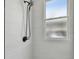 Simple shower with tile surround and window at 834 11Th N St, St Petersburg, FL 33705