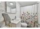 Clean bathroom with floral shower curtain and white vanity at 834 11Th N St, St Petersburg, FL 33705