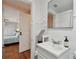 Clean bathroom with white tile and a pedestal sink at 834 11Th N St, St Petersburg, FL 33705