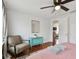 Bedroom with pink bedding, armchair, and hardwood floors at 834 11Th N St, St Petersburg, FL 33705