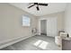 Bright bedroom with ceiling fan and sliding door closet at 834 11Th N St, St Petersburg, FL 33705