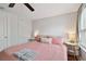 Charming bedroom with pink bedding and ceiling fan at 834 11Th N St, St Petersburg, FL 33705