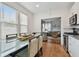 Bright dining area with glass-top table and view into living room at 834 11Th N St, St Petersburg, FL 33705