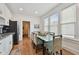 Kitchen dining area with glass-top table and view into living room at 834 11Th N St, St Petersburg, FL 33705