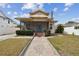 Quaint house with a screened porch and brick walkway at 834 11Th N St, St Petersburg, FL 33705