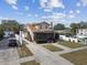 Tan two-story home with front porch and driveway at 834 11Th N St, St Petersburg, FL 33705