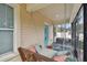 Relaxing screened porch with a swing and seating at 834 11Th N St, St Petersburg, FL 33705