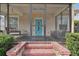 Screened porch with a swing and seating area at 834 11Th N St, St Petersburg, FL 33705