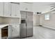 Modern kitchen with stainless steel appliances and white cabinets at 834 11Th N St, St Petersburg, FL 33705