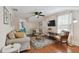 Living room with beige couch, dining table and ceiling fan at 834 11Th N St, St Petersburg, FL 33705