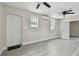 Bright living room with wood-look floors and ceiling fans at 834 11Th N St, St Petersburg, FL 33705