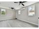 Spacious living room with ceiling fans and wood-look floors at 834 11Th N St, St Petersburg, FL 33705