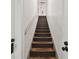 Wooden staircase with dark-painted risers at 834 11Th N St, St Petersburg, FL 33705