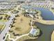 Aerial view of the community featuring lakes, a playground, and green spaces at 8463 Canyon Creek Trl, Parrish, FL 34219