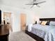 Spacious bedroom with a ceiling fan, ensuite bathroom and walk in closet at 8463 Canyon Creek Trl, Parrish, FL 34219