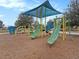 Colorful playground with slides and climbing structures, designed for safe and fun outdoor play at 8463 Canyon Creek Trl, Parrish, FL 34219