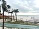 Beachfront view with shuffleboard and pier at 880 Mandalay Ave # N111, Clearwater Beach, FL 33767