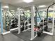 Gym with strength training equipment and mirrors at 880 Mandalay Ave # N111, Clearwater Beach, FL 33767